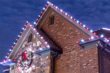 christmas lights on roof of brick home